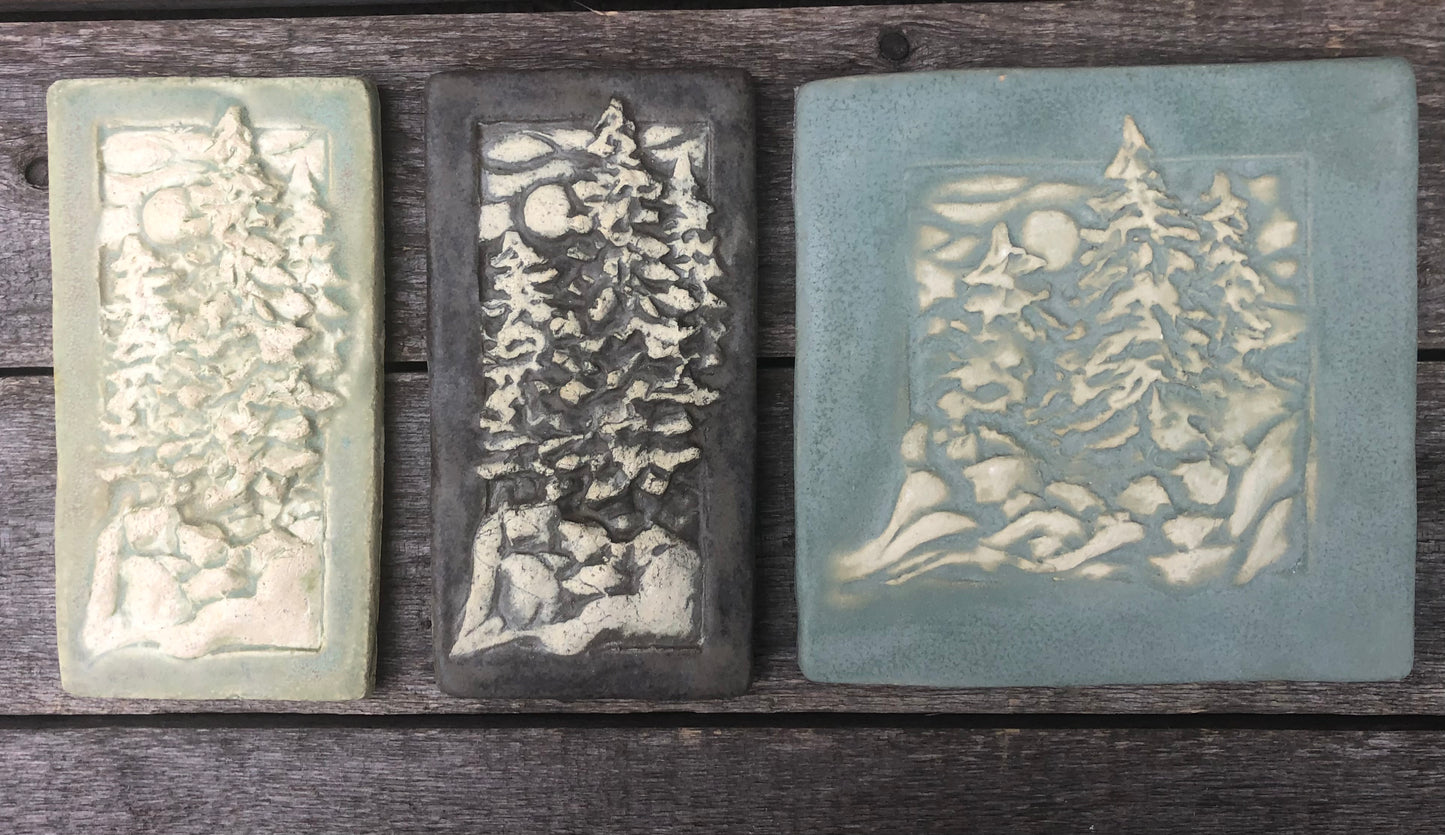The Green wash tile sits alongside others washed
Matte tile in River Rock and Moth Green.